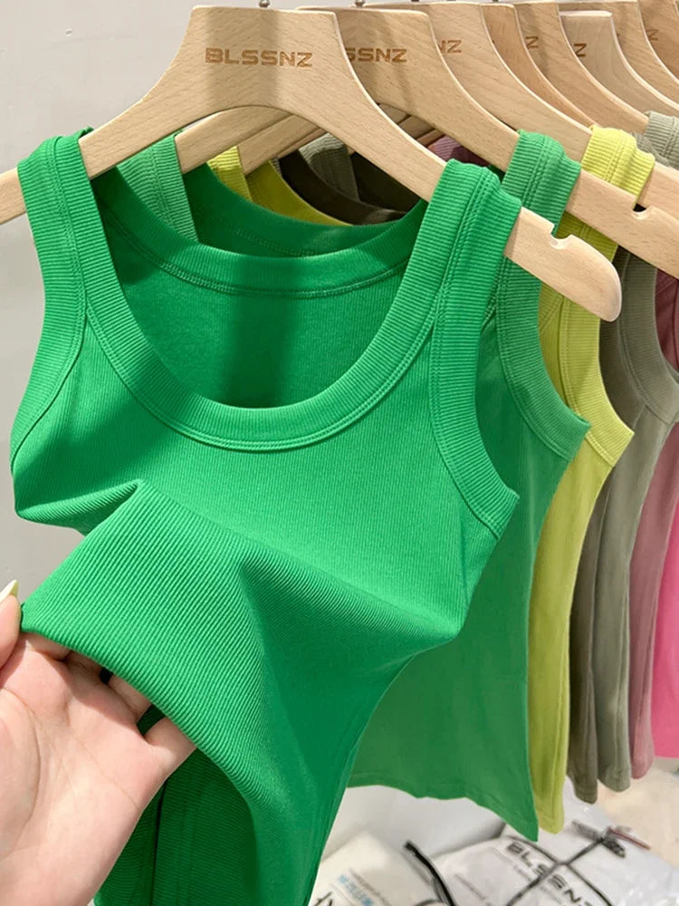 Women's plain tank top with a round neck and ribbed texture.