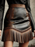 Vintage Western-style mini skirt with fringed hem, fashionable women's skirt in faux leather.