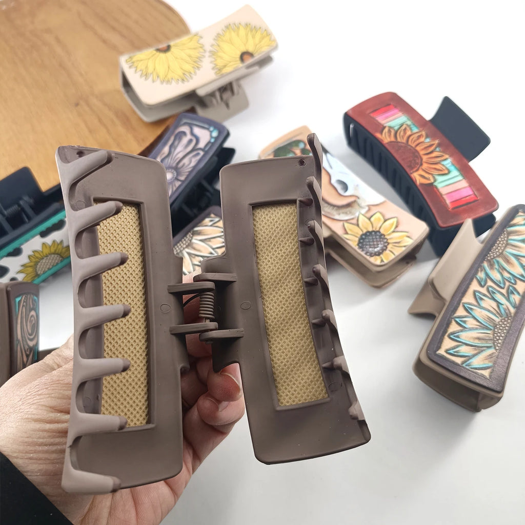 Large, cowboy-style PU leather hair clips with a sunflower print, non-slip grip.
