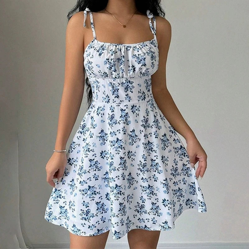 Women's short beach dress with floral print and thin straps.