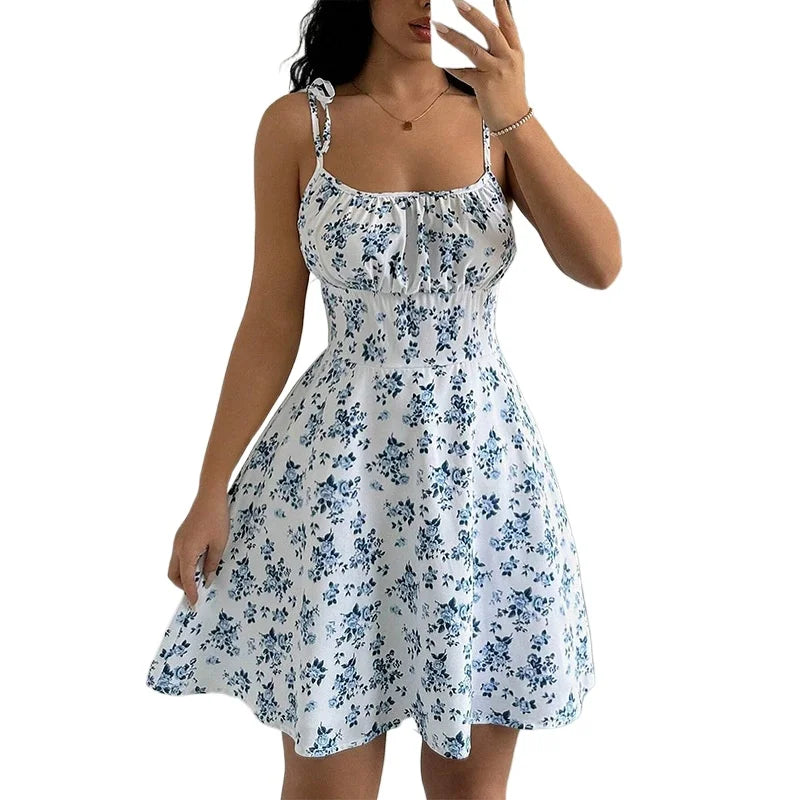 Women's short beach dress with floral print and thin straps.