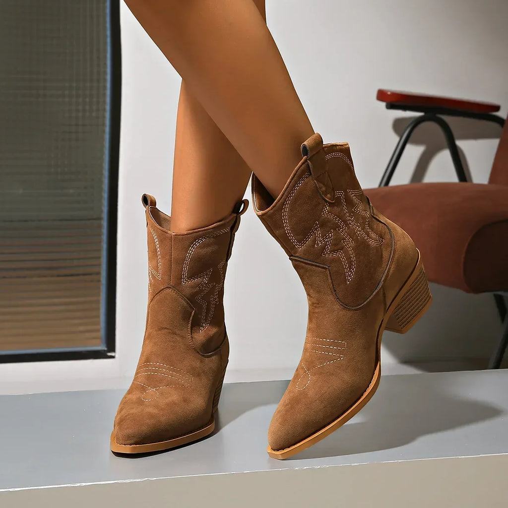 Pointed toe, riding boots with chunky heel.