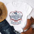 Women's vintage country-style t-shirt with a Nashville rodeo print.