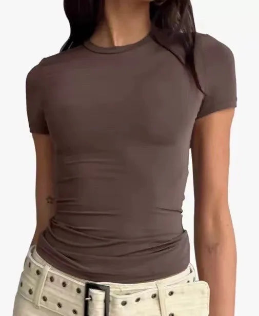 Basic casual women's blouses in the Y2K style, featuring a round neck, short sleeves, a cropped design, and a fitted, elegant silhouette.