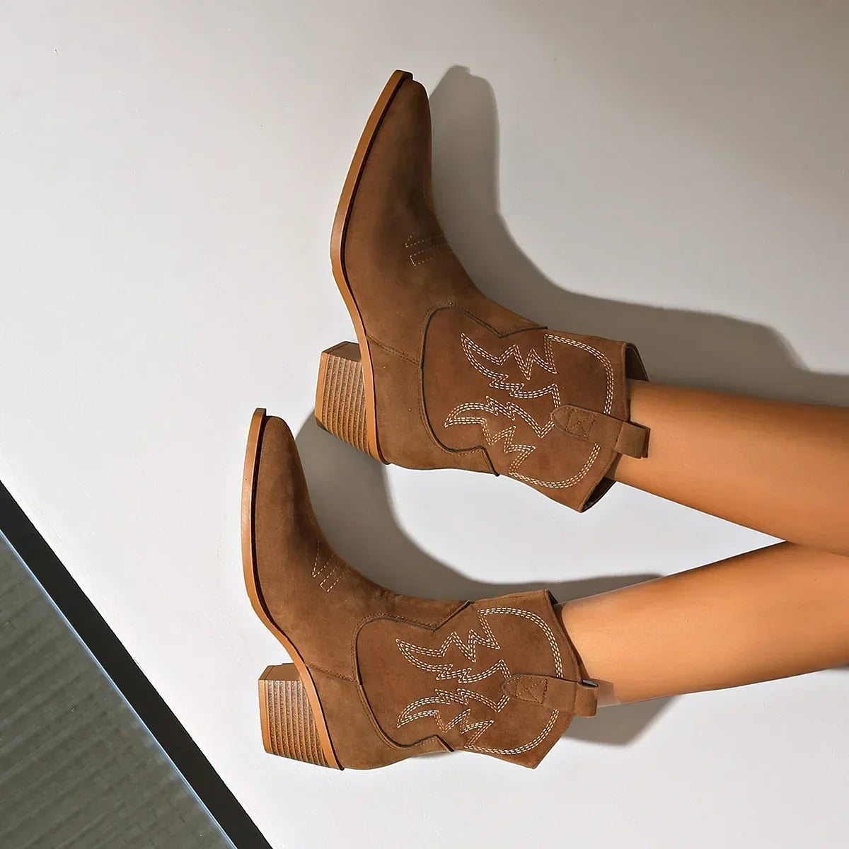Pointed toe, riding boots with chunky heel.