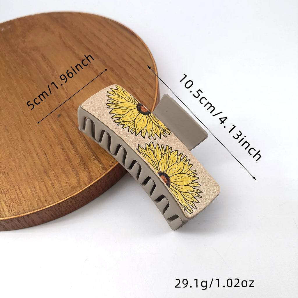 Large, cowboy-style PU leather hair clips with a sunflower print, non-slip grip.