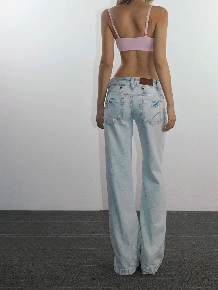 Women's casual light blue low-waisted jeans, streetwear style.