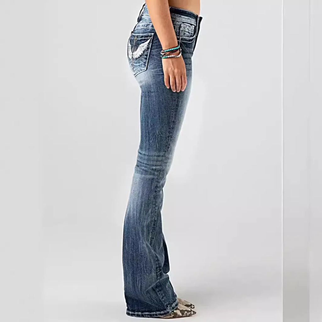 Women's jeans with embroidered pockets, distressed effect, mid-rise waist, slim fit, vintage style.