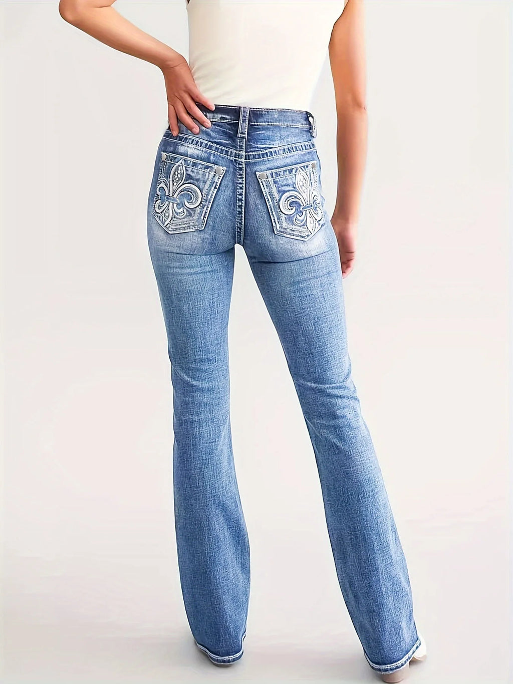 Women's straight-leg jeans, high-waisted, vintage style.
