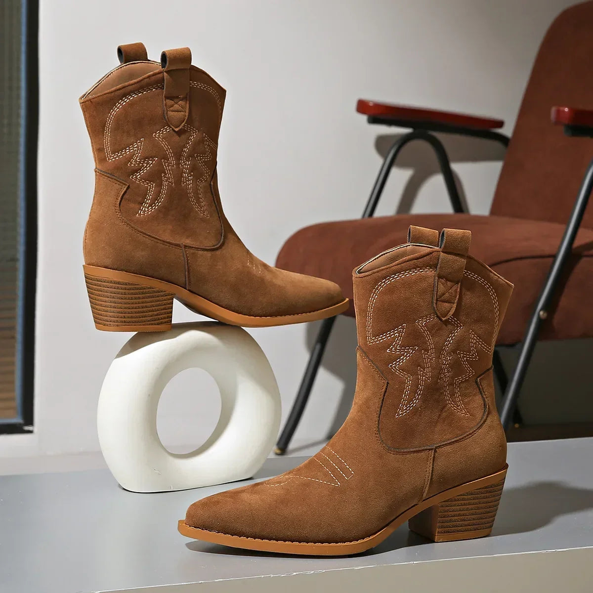 Pointed toe, riding boots with chunky heel.